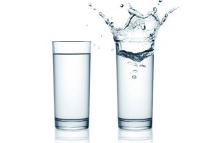 two glasses of water with splash